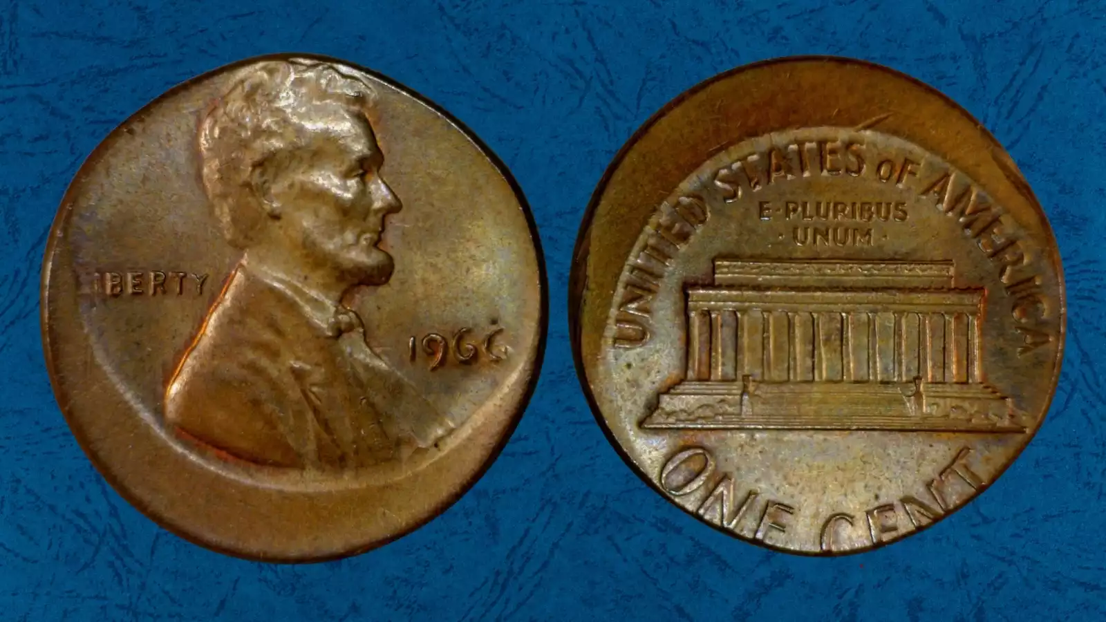 1966 penny off-center strike error showing date and Lincoln portrait displaced with crescent of bare planchet